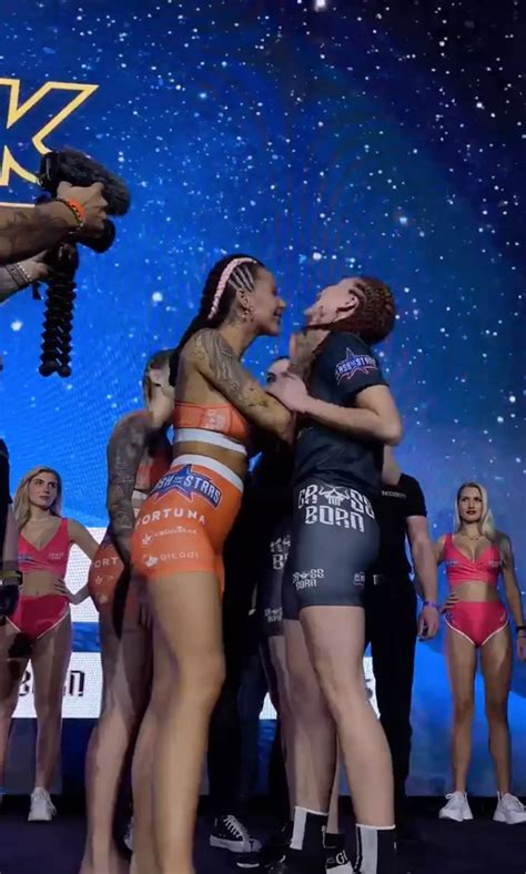 Crowd left stunned after two MMA fighters kiss during face off